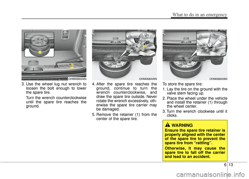 KIA Borrego 2011 1.G Owners Manual 613
What to do in an emergency
3. Use the wheel lug nut wrench toloosen the bolt enough to lower
the spare tire.
Turn the wrench counterclockwise
until the spare tire reaches the
ground. 4. After the 