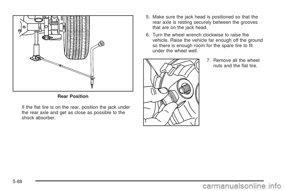 CHEVROLET COLORADO 2009 1.G Owners Manual If the �at tire is on the rear, position the jack under
the rear axle and get as close as possible to the
shock absorber.5. Make sure the jack head is positioned so that the
rear axle is resting secur