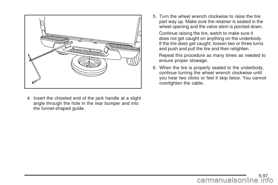CHEVROLET COLORADO 2009 1.G Owners Manual 4. Insert the chiseled end of the jack handle at a slight
angle through the hole in the rear bumper and into
the funnel-shaped guide.5. Turn the wheel wrench clockwise to raise the tire
part way up. M
