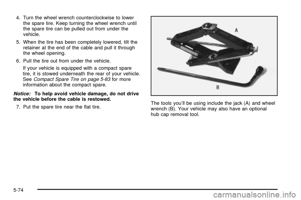 CHEVROLET S10 2003 2.G Owners Manual 4. Turn the wheel wrench counterclockwise to lower
the spare tire. Keep turning the wheel wrench until
the spare tire can be pulled out from under the
vehicle.
5. When the tire has been completely low