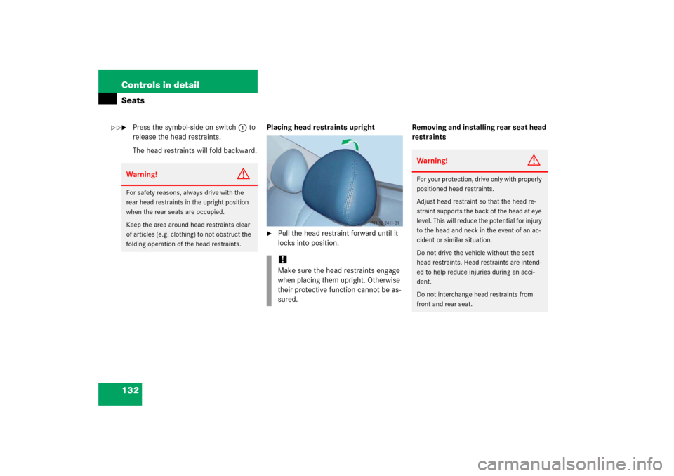 MERCEDES-BENZ E500 2006 W211 Owners Manual 132 Controls in detailSeats
Press the symbol-side on switch1to 
release the head restraints.
The head restraints will fold backward.Placing head restraints upright

Pull the head restraint forward u