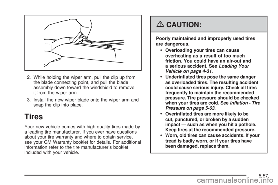 BUICK LACROSSE 2006  Owners Manual 2. While holding the wiper arm, pull the clip up from
the blade connecting point, and pull the blade
assembly down toward the windshield to remove
it from the wiper arm.
3. Install the new wiper blade