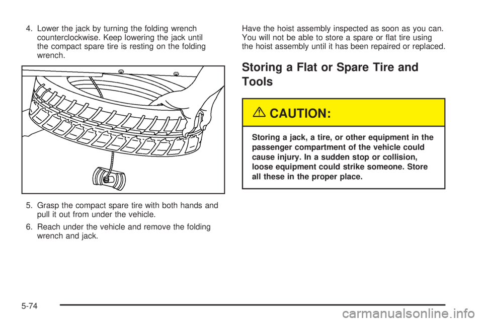 BUICK TERRAZA 2005 User Guide 4. Lower the jack by turning the folding wrench
counterclockwise. Keep lowering the jack until
the compact spare tire is resting on the folding
wrench.
5. Grasp the compact spare tire with both hands 