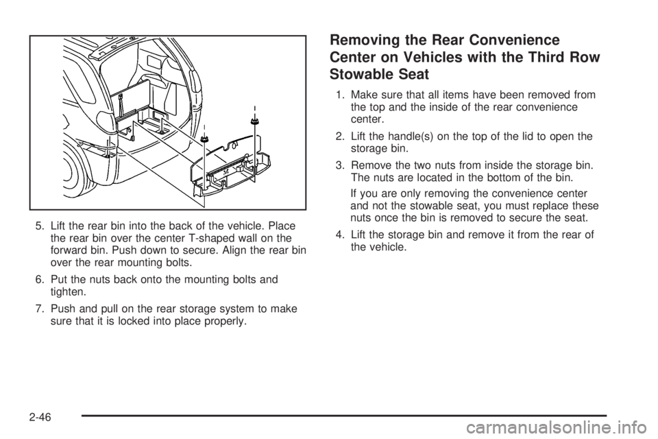 BUICK RANDEZVOUS 2004 Owners Guide 5. Lift the rear bin into the back of the vehicle. Place
the rear bin over the center T-shaped wall on the
forward bin. Push down to secure. Align the rear bin
over the rear mounting bolts.
6. Put the