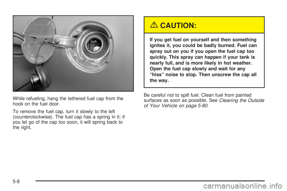 BUICK LESABRE 2003  Owners Manual While refueling, hang the tethered fuel cap from the
hook on the fuel door.
To remove the fuel cap, turn it slowly to the left
(counterclockwise). The fuel cap has a spring in it; if
you let go of the