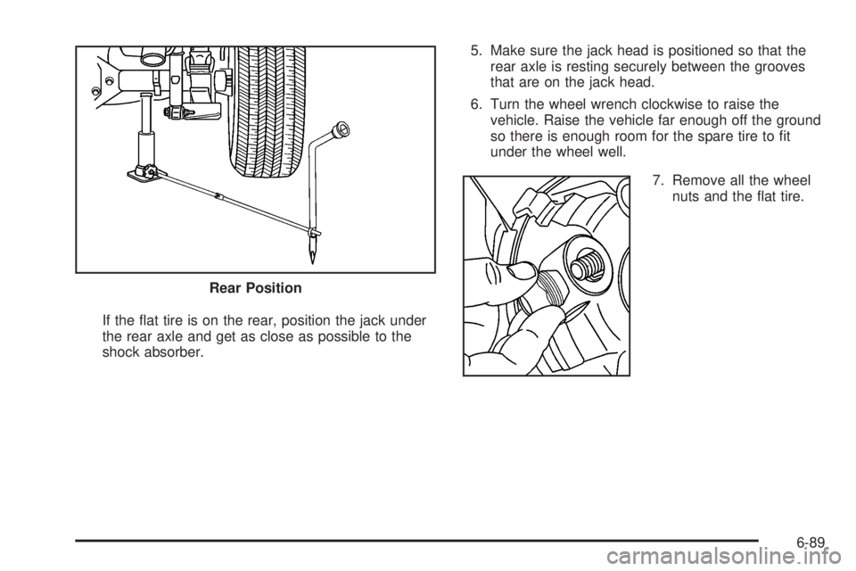 GMC CANYON 2010  Owners Manual If the ﬂat tire is on the rear, position the jack under
the rear axle and get as close as possible to the
shock absorber.5. Make sure the jack head is positioned so that the
rear axle is resting sec