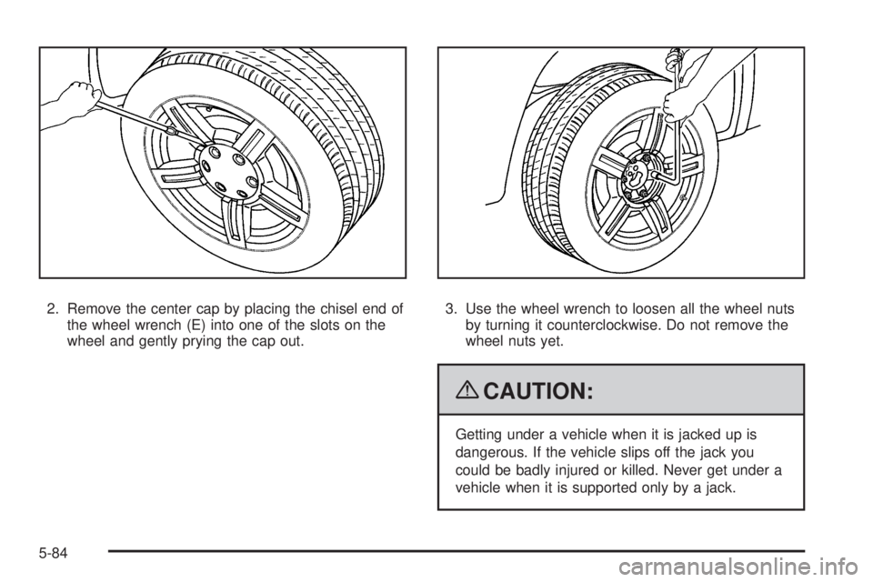 GMC CANYON 2009  Owners Manual 2. Remove the center cap by placing the chisel end of
the wheel wrench (E) into one of the slots on the
wheel and gently prying the cap out.3. Use the wheel wrench to loosen all the wheel nuts
by turn