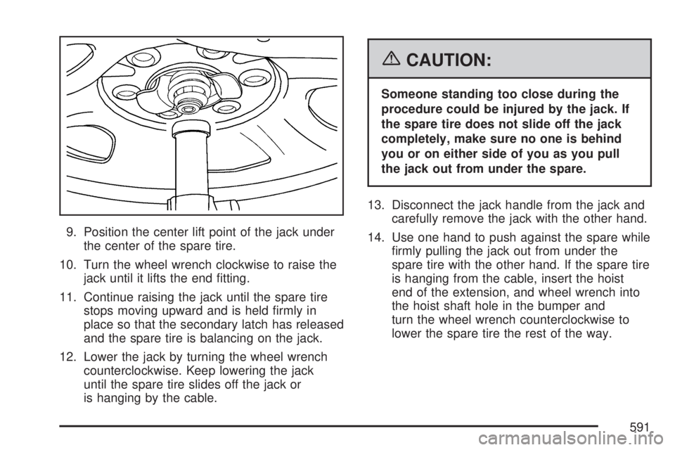 GMC SIERRA 2007  Owners Manual 9. Position the center lift point of the jack under
the center of the spare tire.
10. Turn the wheel wrench clockwise to raise the
jack until it lifts the end �tting.
11. Continue raising the jack unt