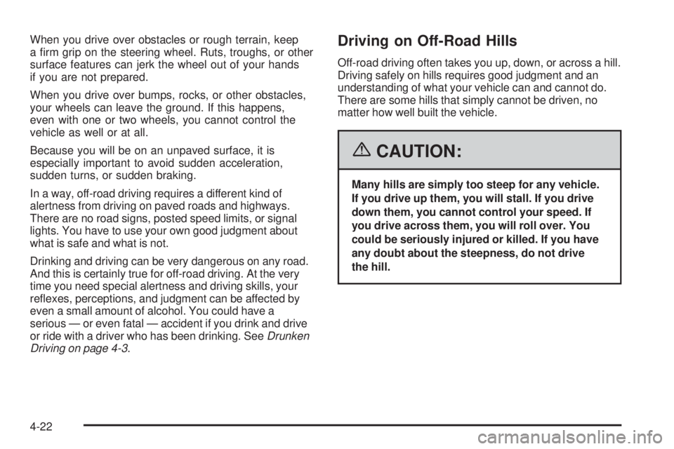 GMC SIERRA 2006  Owners Manual When you drive over obstacles or rough terrain, keep
a �rm grip on the steering wheel. Ruts, troughs, or other
surface features can jerk the wheel out of your hands
if you are not prepared.
When you d