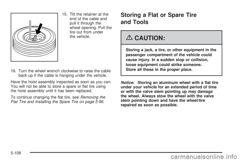 GMC SIERRA 2006  Owners Manual 15. Tilt the retainer at the
end of the cable and
pull it through the
wheel opening. Pull the
tire out from under
the vehicle.
16. Turn the wheel wrench clockwise to raise the cable
back up if the cab