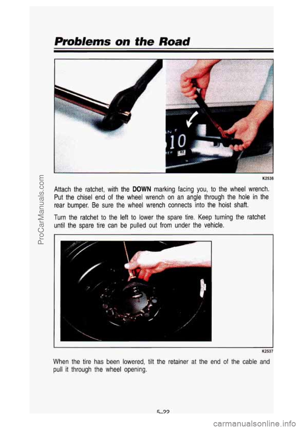 GMC SIERRA 1993  Owners Manual Problems on the Road 
"I 
K2536 
Attach  the  ratchet,  with  the DOWN marking  facing  you, to the  wheel  wrench. 
Put  the  chisel  end 
of the  wheel  wrench  on  an  angle  through  the  hole  in