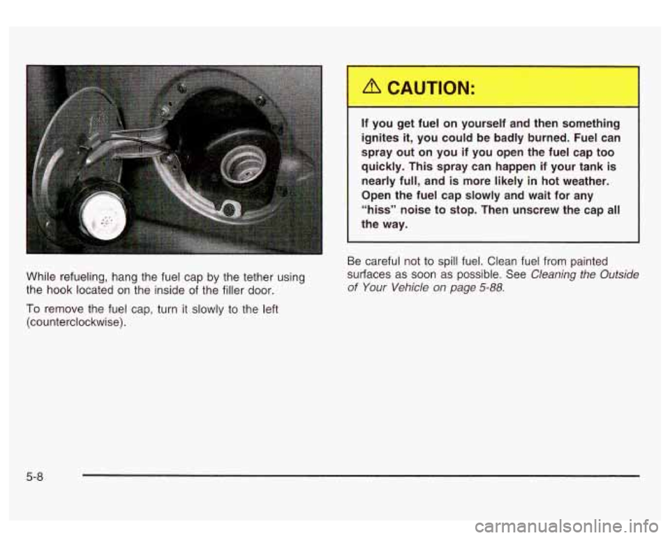 GMC SIERRA DENALI 2003 Owners Manual While refueling, hang the fuel cap by the tether using
the hook located on the inside of the filler door.
To remove the fuel cap, turn it slowly to the left
(counterclockwise).
- -
GMC SIERRA DENALI 2003 Owners Manual While refueling, hang the fuel cap by the tether using
the hook located on the inside of the filler door.
To remove the fuel cap, turn it slowly to the left
(counterclockwise).
- -