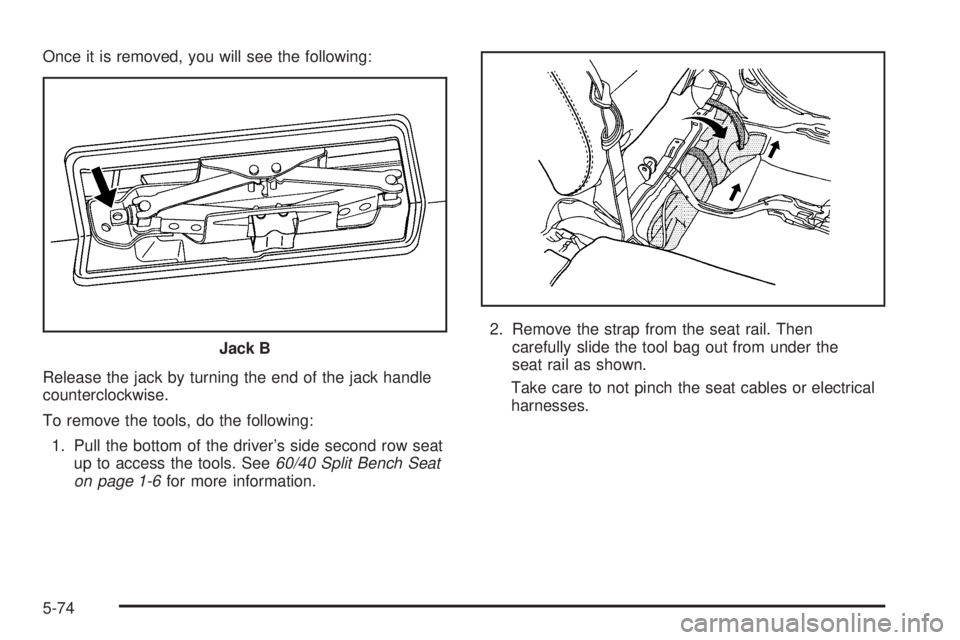 HUMMER H2 2006  Owners Manual Once it is removed, you will see the following:
Release the jack by turning the end of the jack handle
counterclockwise.
To remove the tools, do the following:
1. Pull the bottom of the driver’s sid