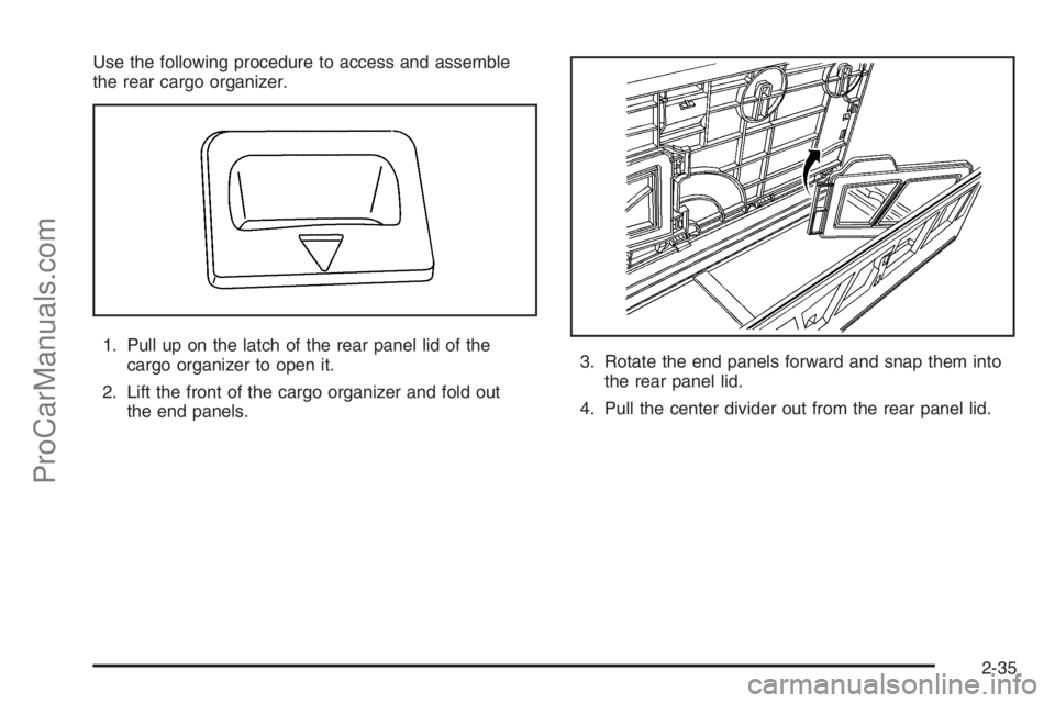 SATURN VUE 2006  Owners Manual Use the following procedure to access and assemble
the rear cargo organizer.
1. Pull up on the latch of the rear panel lid of the
cargo organizer to open it.
2. Lift the front of the cargo organizer a
